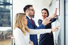 Group Of Business people discussing new project on whiteboard stock photo Group Of Business people discussing new project on whiteboard stock photo