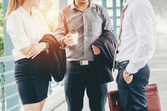 Group of Business people talking in outside office building after work stock photos Group of Business people talking in outside office building after work stock photos