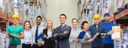 Group of business people and warehouse workers stock photo Group of business people and warehouse workers stock photo