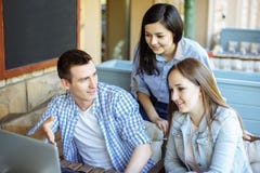 Group of casual business people working on new project .They using laptop and discuss about concept. Solving problems stock image Group of casual business people working on new project .They using laptop and discuss about concept. Solving problems stock image