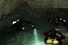 A group of divers is preparing to dive into the underwater part of the Orda Cave royalty free stock photo A group of divers is preparing to dive into the underwater part of the Orda Cave royalty free stock photo
