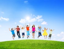 Group of Diverse Children Jumping Outdoors stock images Group of Diverse Children Jumping Outdoors stock images