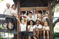 Group of diverse kindergarten students at playground together stock photos Group of diverse kindergarten students at playground together stock photos