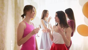Group of four young ladies celebrating hen party at home
