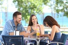 Group of friends laughing and refreshing in a bar stock photography Group of friends laughing and refreshing in a bar stock photography