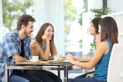 Group of friends meeting at home stock photo Group of friends meeting at home stock photo