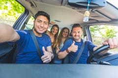 Group of friends taking a selfie into the car stock photography Group of friends taking a selfie into the car stock photography