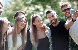 Group of friends taking selfies in the Park royalty free stock images Group of friends taking selfies in the Park royalty free stock images