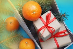 Group of Gift boxes Wrapped in Craft Paper with Satin Ribbon Tangerine and Christmas on blue Background royalty free stock photography Group of Gift boxes Wrapped in Craft Paper with Satin Ribbon Tangerine and Christmas on blue Background royalty free stock photography