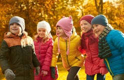Group of happy children having fun in autumn park Royalty Free Stock Photos Group of happy children having fun in autumn park Royalty Free Stock Photos