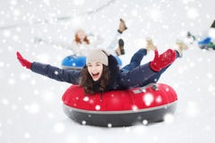 Group of happy friends sliding down on snow tubes royalty free stock image Group of happy friends sliding down on snow tubes royalty free stock image