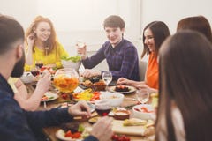 Group of happy people at festive table dinner party. Pretty girls talking. stock image Group of happy people at festive table dinner party. Pretty girls talking. stock image