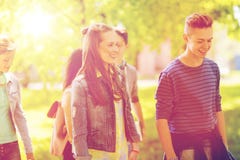 Group of happy teenage students walking outdoors Stock Photos Group of happy teenage students walking outdoors Stock Photos