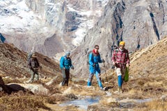 Group of Hikers walking along frozen Creek in Mountain Valley royalty free stock photo Group of Hikers walking along frozen Creek in Mountain Valley royalty free stock photo