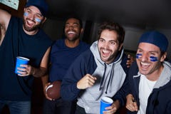 Group Of Male Sports Fans Watching Game On Television stock images Group Of Male Sports Fans Watching Game On Television stock images