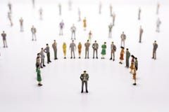 Group of miniature people over white background standing in line royalty free stock photography Group of miniature people over white background standing in line royalty free stock photography