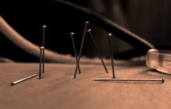 Group of nails stuck in material Royalty Free Stock Photography Group of nails stuck in material Royalty Free Stock Photography