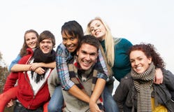 Group Of Teenage Friends Having Piggyback Rides Royalty Free Stock Images