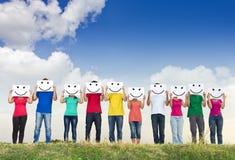 Group Of Young People Holding Papers With Smileys Royalty Free Stock Photography Group Of Young People Holding Papers With Smileys Royalty Free Stock Photography