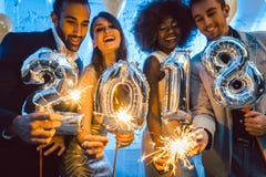Group of party people celebrating the arrival of 2018 Royalty Free Stock Image Group of party people celebrating the arrival of 2018 Royalty Free Stock Image