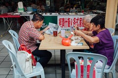 Group of senior Chinese people having a breakfast in traditional Royalty Free Stock Images Group of senior Chinese people having a breakfast in traditional Royalty Free Stock Images