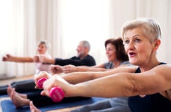 Group of senior people doing exercise with dumbbells in community center club. royalty free stock image Group of senior people doing exercise with dumbbells in community center club. royalty free stock image