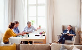 Group of senior people playing board games in community center club. stock photography Group of senior people playing board games in community center club. stock photography