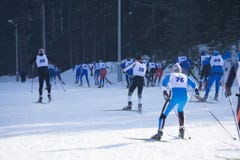 A group of skiers climbs up the snow-covered ski track defocused . royalty free stock photos A group of skiers climbs up the snow-covered ski track defocused . royalty free stock photos
