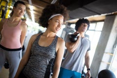 Group of sportive people in a gym. Concepts about lifestyle and sport in a fitness club royalty free stock photography Group of sportive people in a gym. Concepts about lifestyle and sport in a fitness club royalty free stock photography