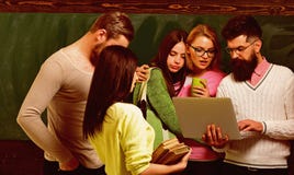 Group of students, groupmates spend time with teacher, lecturer, professor. College and university concept. Students stock photos Group of students, groupmates spend time with teacher, lecturer, professor. College and university concept. Students stock photos