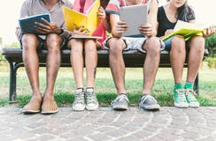 Group of students studying outdoor. stock photos Group of students studying outdoor. stock photos