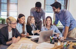Group of young business people in smart casual wear working together stock images Group of young business people in smart casual wear working together stock images