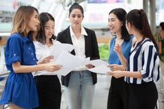 group of young businesswomen meeting in a conference wiht paper work and document outside office in urban city royalty free stock photos group of young businesswomen meeting in a conference wiht paper work and document outside office in urban city royalty free stock photos