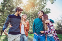Group of young people walking through park. Stock Photography Group of young people walking through park. Stock Photography