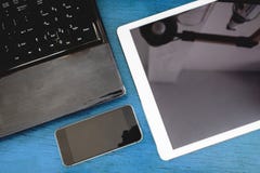 Group of modern electronic devices, computer laptop, digital tablet and mobile smart phone on wooden table. Groups of modern electronic devices, computer laptop Royalty Free Stock Images Group of modern electronic devices, computer laptop, digital tablet and mobile smart phone on wooden table. Groups of modern electronic devices, computer laptop Royalty Free Stock Images