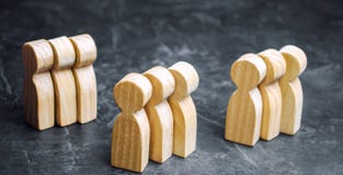Groups of wooden people. The concept of market segmentation. Mar stock photos Groups of wooden people. The concept of market segmentation. Mar stock photos