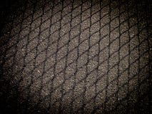 Shadow from mesh fencing on asphalt with dark frame stock image Shadow from mesh fencing on asphalt with dark frame stock image