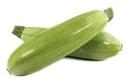 gröna zucchinigrönsaker på vit bakgrund Royaltyfri Fotografi gröna zucchinigrönsaker på vit bakgrund Royaltyfri Fotografi