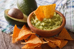 Guacamole sauce, nachos and avocado closeup. Horizontal Royalty Free Stock Photos Guacamole sauce, nachos and avocado closeup. Horizontal Royalty Free Stock Photos