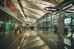 Guangzhou, China - June 25, 2018: Semi-empty bright hall in a modern airport. stock images Guangzhou, China - June 25, 2018: Semi-empty bright hall in a modern airport. stock images