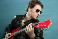Guitar rock star man sunglasses leather jacket Royalty Free Stock Photography Guitar rock star man sunglasses leather jacket Royalty Free Stock Photography