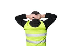 Gula västprotester Den unga mannen står med hans baksida och rymmer hans händer på hans huvud på isolerat arkivbilder Gula västprotester Den unga mannen står med hans baksida och rymmer hans händer på hans huvud på isolerat arkivbilder