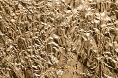 Guld- folie som en bakgrund Arkivfoto Guld- folie som en bakgrund Arkivfoto