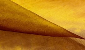 Guld som förtjänar tyg arkivbilder Guld som förtjänar tyg arkivbilder