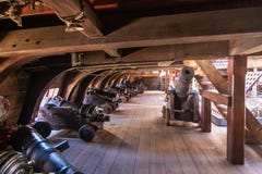 On the gun deck of an old pirate ship moored in the port of Genoa, Italy stock photography On the gun deck of an old pirate ship moored in the port of Genoa, Italy stock photography