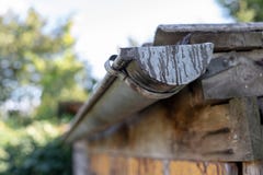 Gutter draining rainwater. The building is equipped with drainage of rainwater from the roof. royalty free stock photography Gutter draining rainwater. The building is equipped with drainage of rainwater from the roof. royalty free stock photography