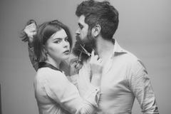 Guy with modern hairstyle visiting hairdresser. Barbershop or hairdresser concept. Man with long beard, mustache and Royalty Free Stock Images Guy with modern hairstyle visiting hairdresser. Barbershop or hairdresser concept. Man with long beard, mustache and Royalty Free Stock Images