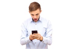 The guy in the shirt is playing hard in the phone royalty free stock photography The guy in the shirt is playing hard in the phone royalty free stock photography