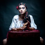 Gypsy fortune teller mixing the tarot cards.
