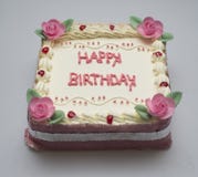 Gâteau d'anniversaire carré pour la fille photo stock Gâteau d'anniversaire carré pour la fille photo stock